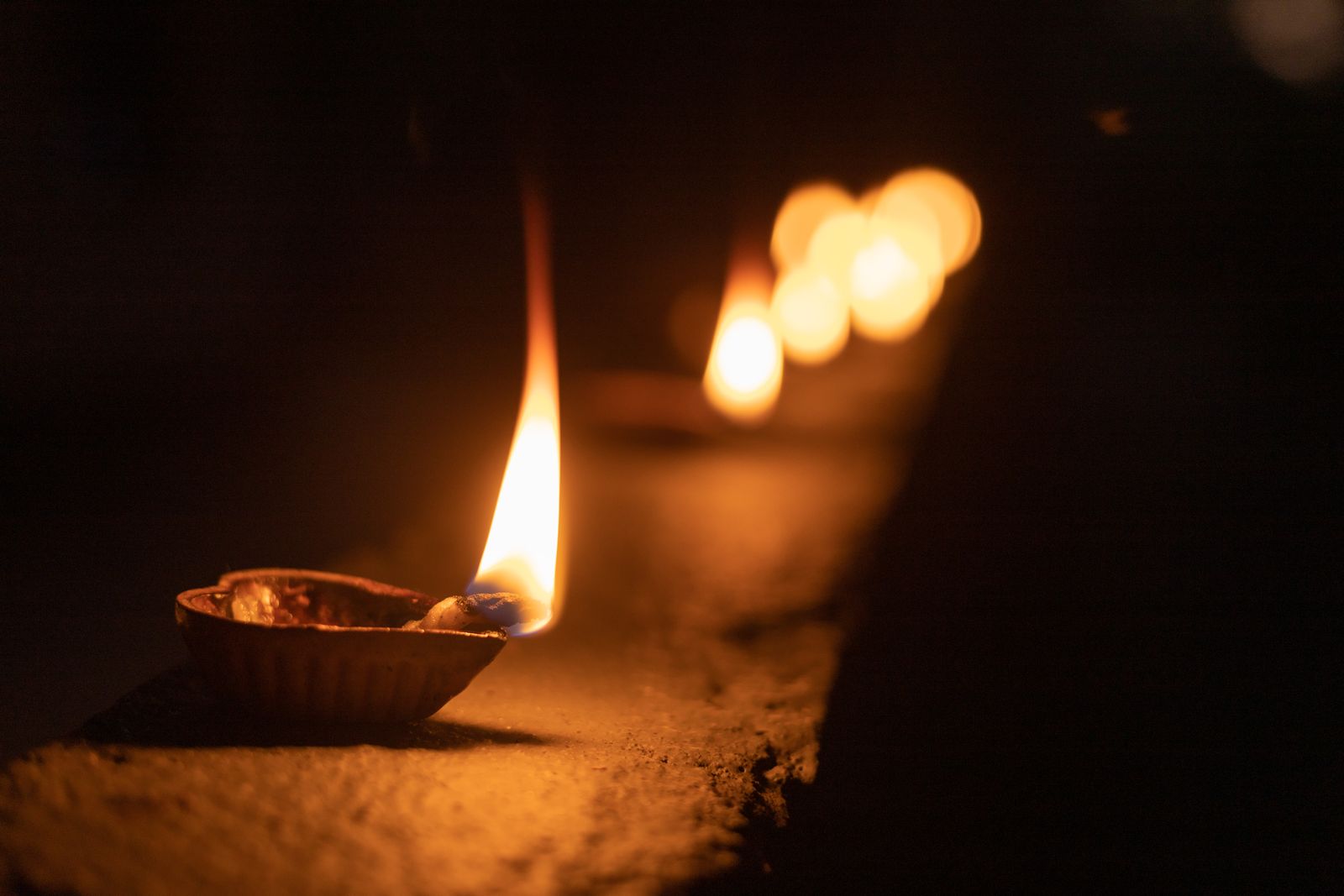 Diya lamps lit for a community celebration